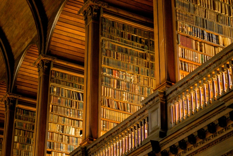 the inside of an old bookshelf with the lights on