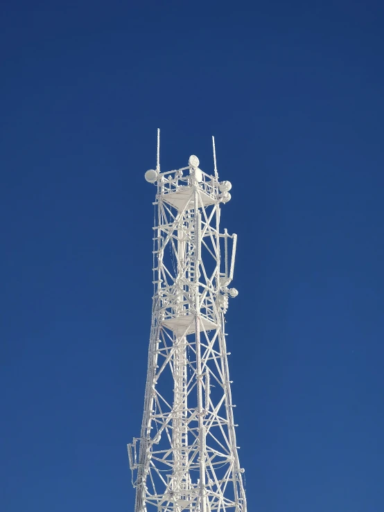 a tall tower sitting on top of a metal base