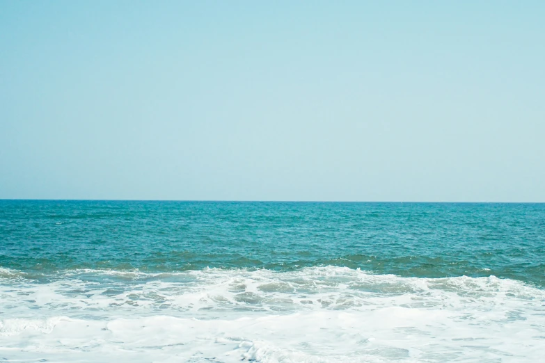 a person surfing a wave in the water