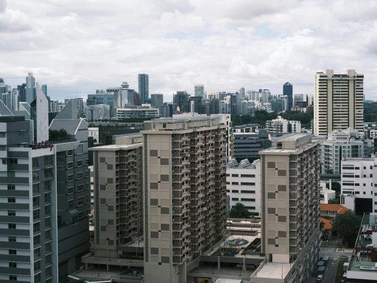 buildings with balconies in the foreground and other tall city skyscrs