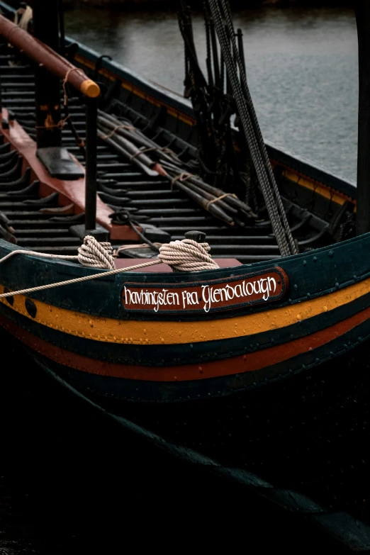 a large boat on a lake next to water