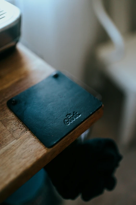 a close up of a notebook sitting on top of a wooden desk