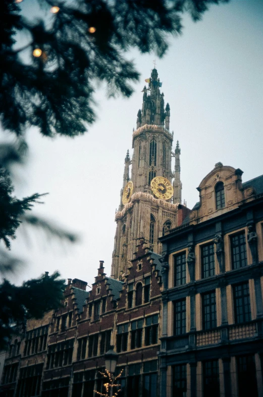 a cathedral style building sits in front of a clock