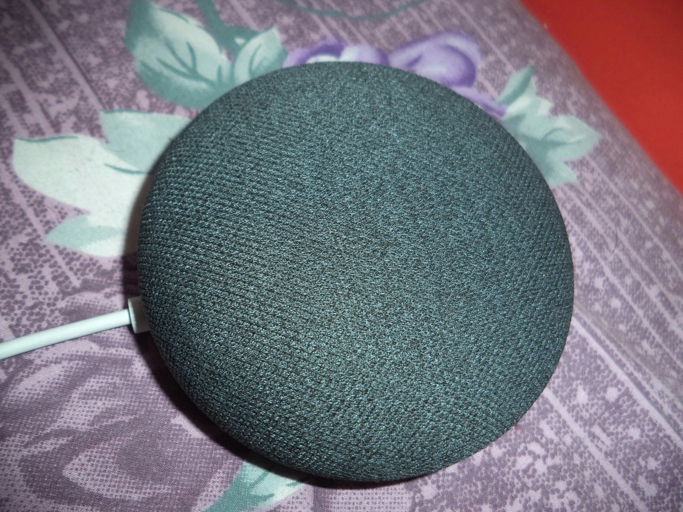 an image of an audio device sitting on a pillow