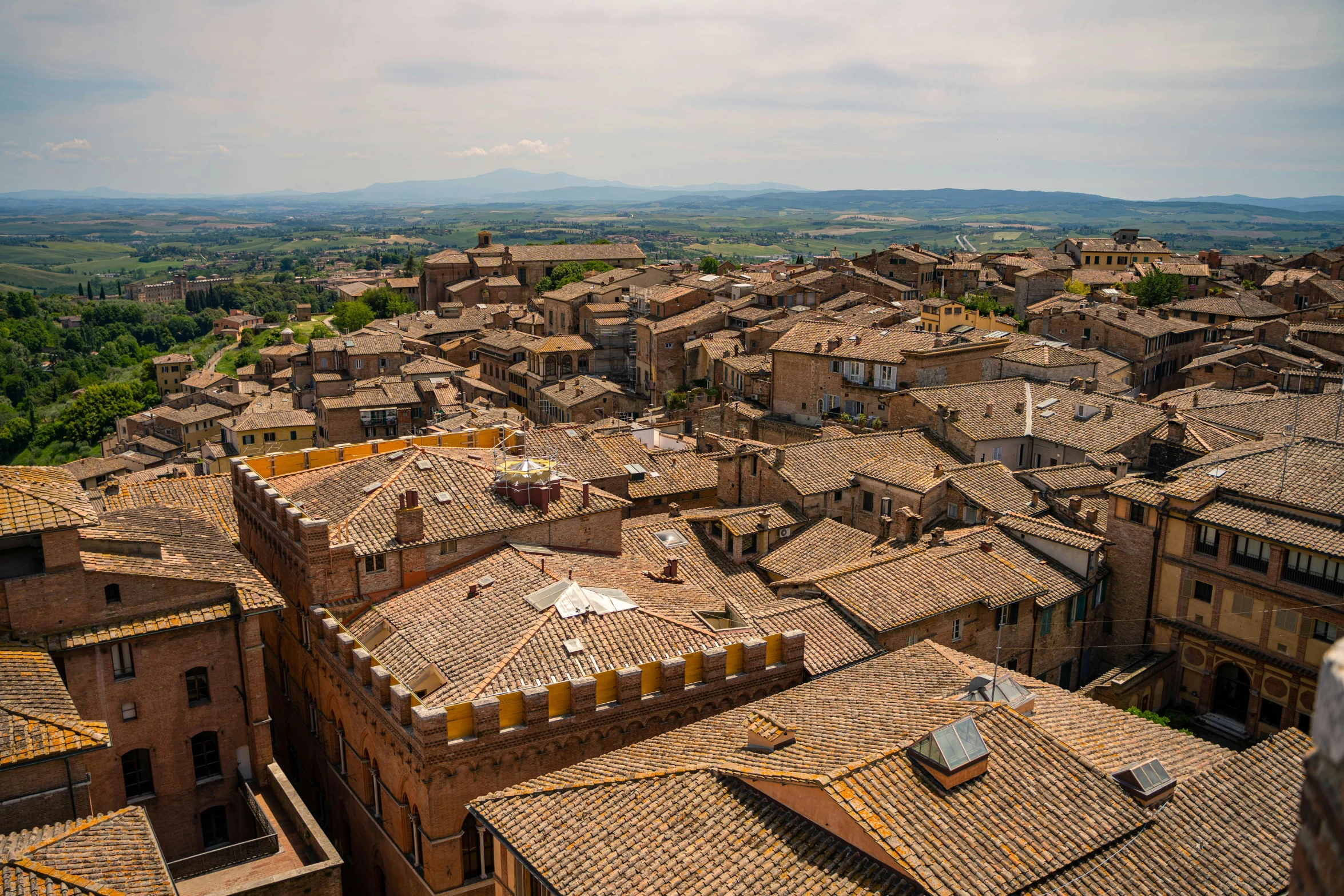 an aerial view of the rooftops and surrounding buildings