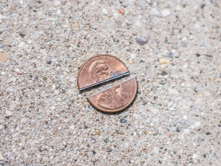 a penny with the end of it being cut