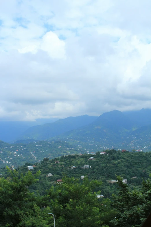 the beautiful view of a city near mountains