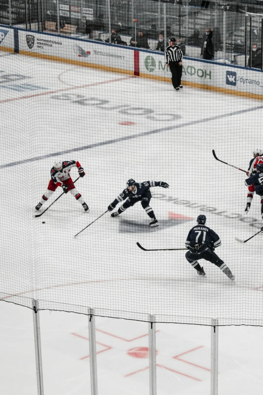 several teams playing ice hockey in the snow