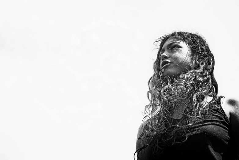 a woman with wet hands under her hair