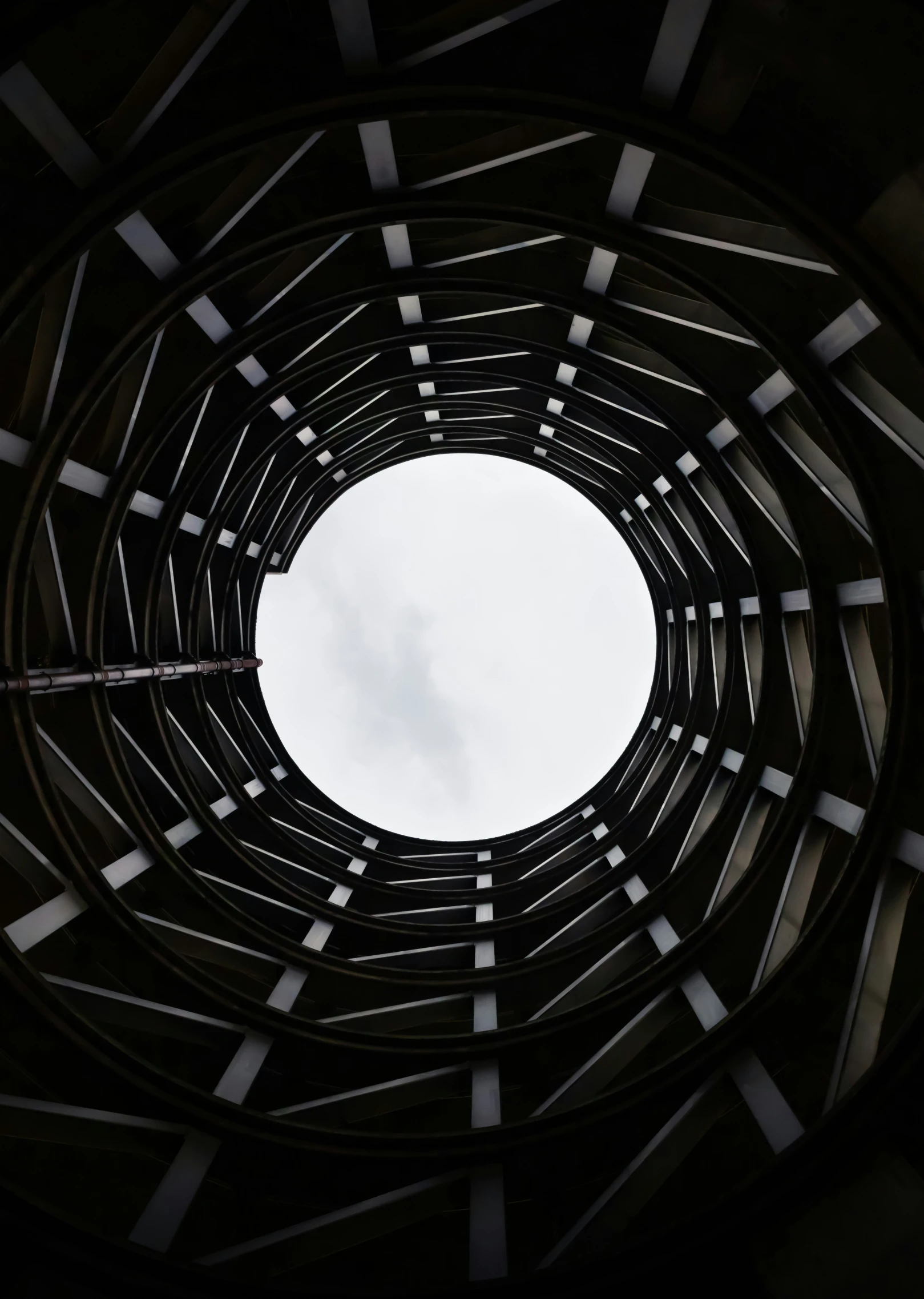 the inside of an artistic round hole in the ceiling