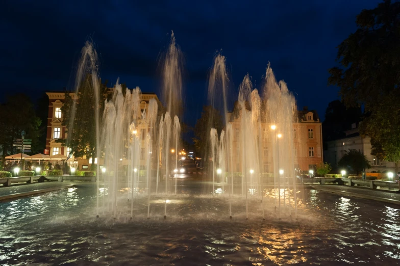 the view from the corner shows some large fountains spraying water