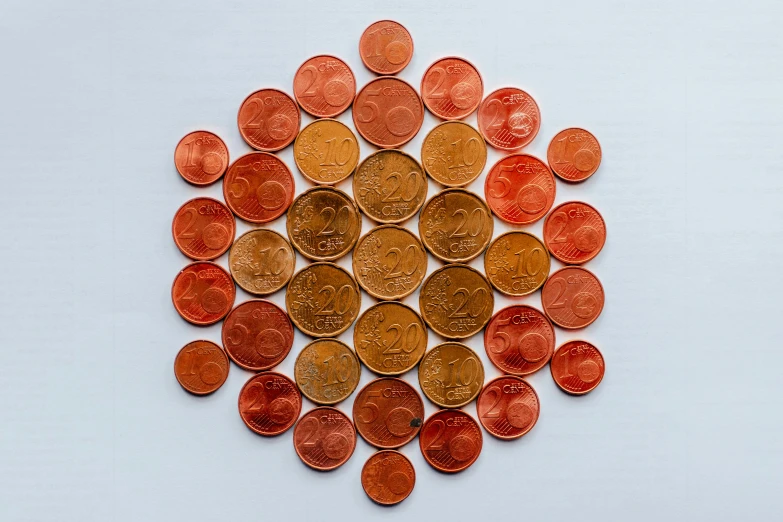 a group of foreign coins arranged in a circle