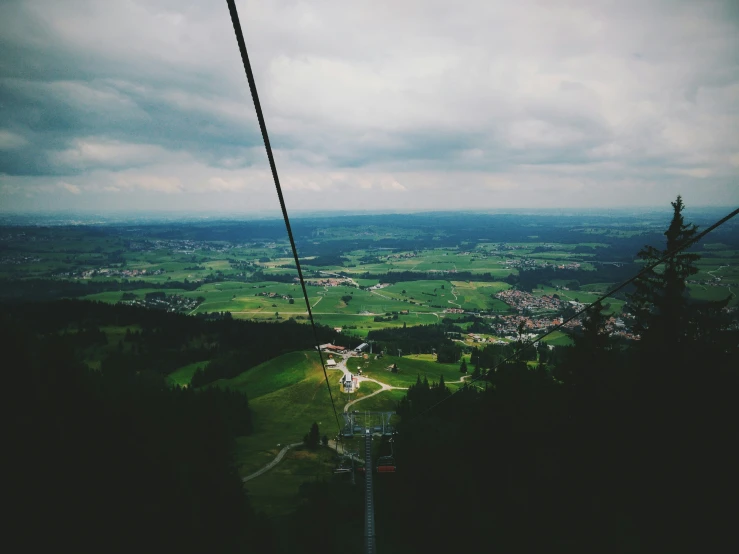 a view from above looking down at an open green valley