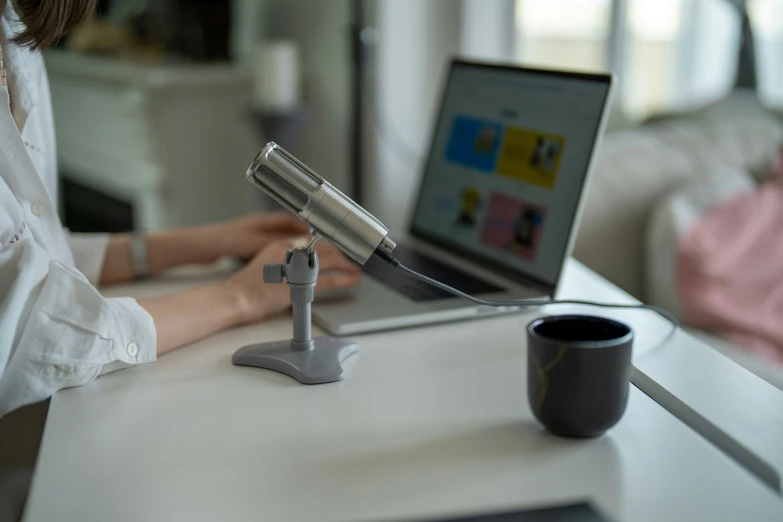 a woman that is sitting in front of a laptop