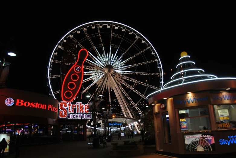 a large ferris wheel lit up with lights