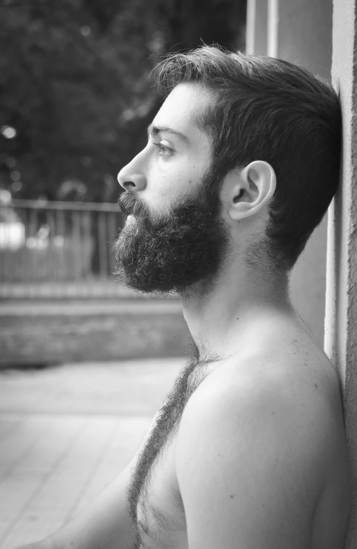 a man with a beard looking up into the sky