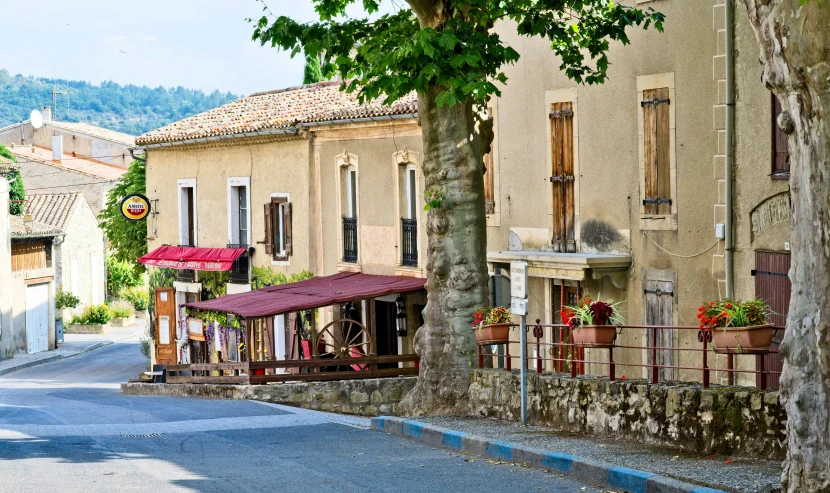 an old city street is lined with brown buildings