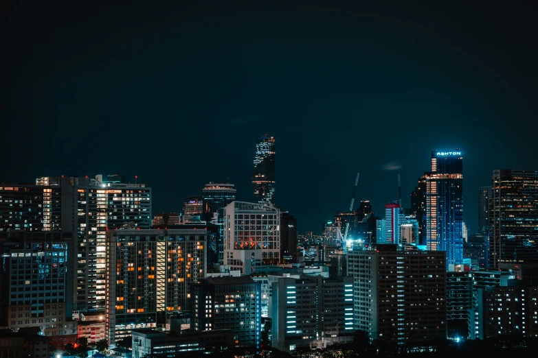 a large city skyline with buildings lit up