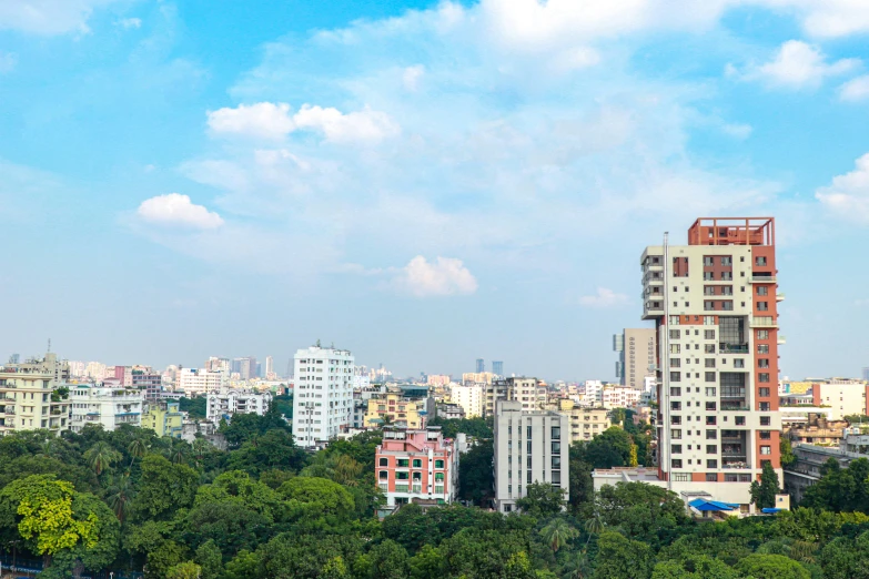 tall buildings are in the foreground, a city far away