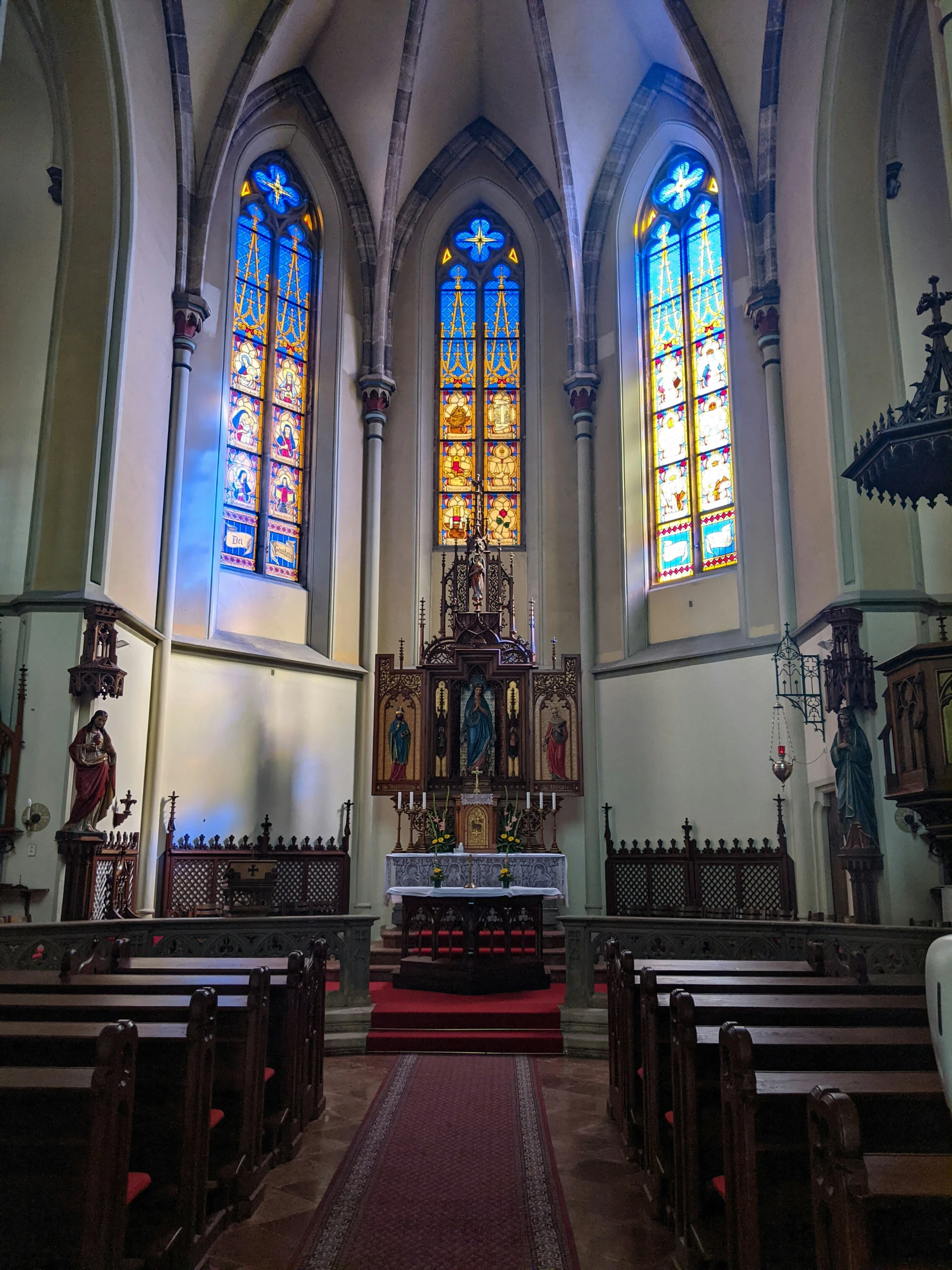 the interior of a church with stained glass