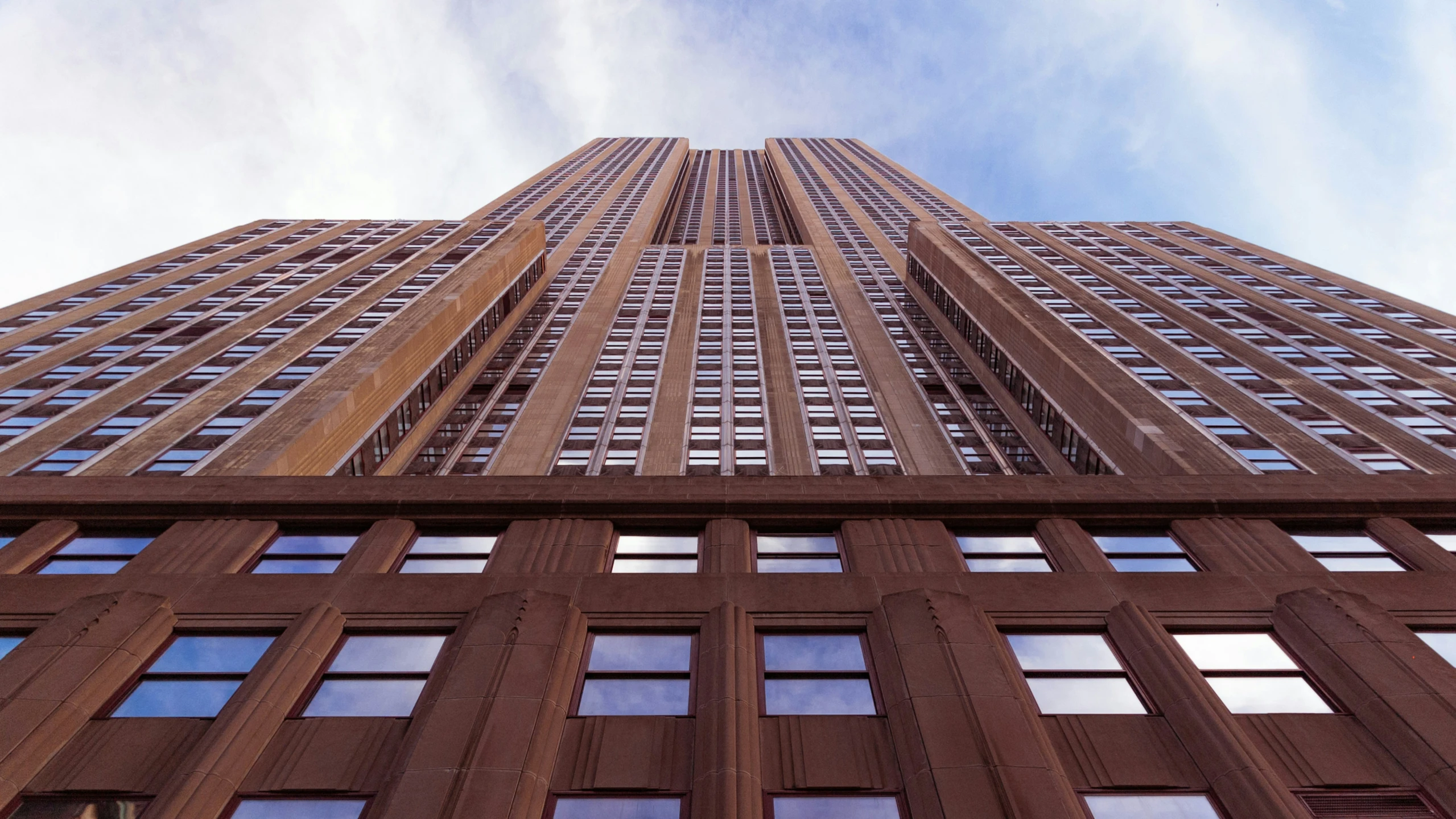 looking up at the side of a tall building