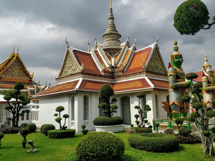 an image of a building with many plants in front