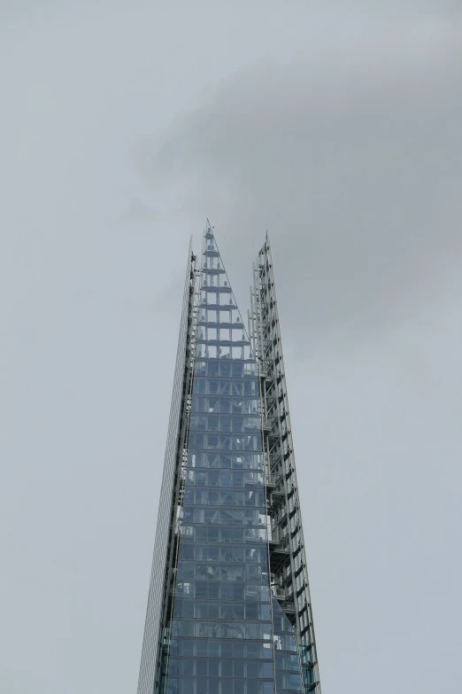 the top of a modern glass skyscr in paris