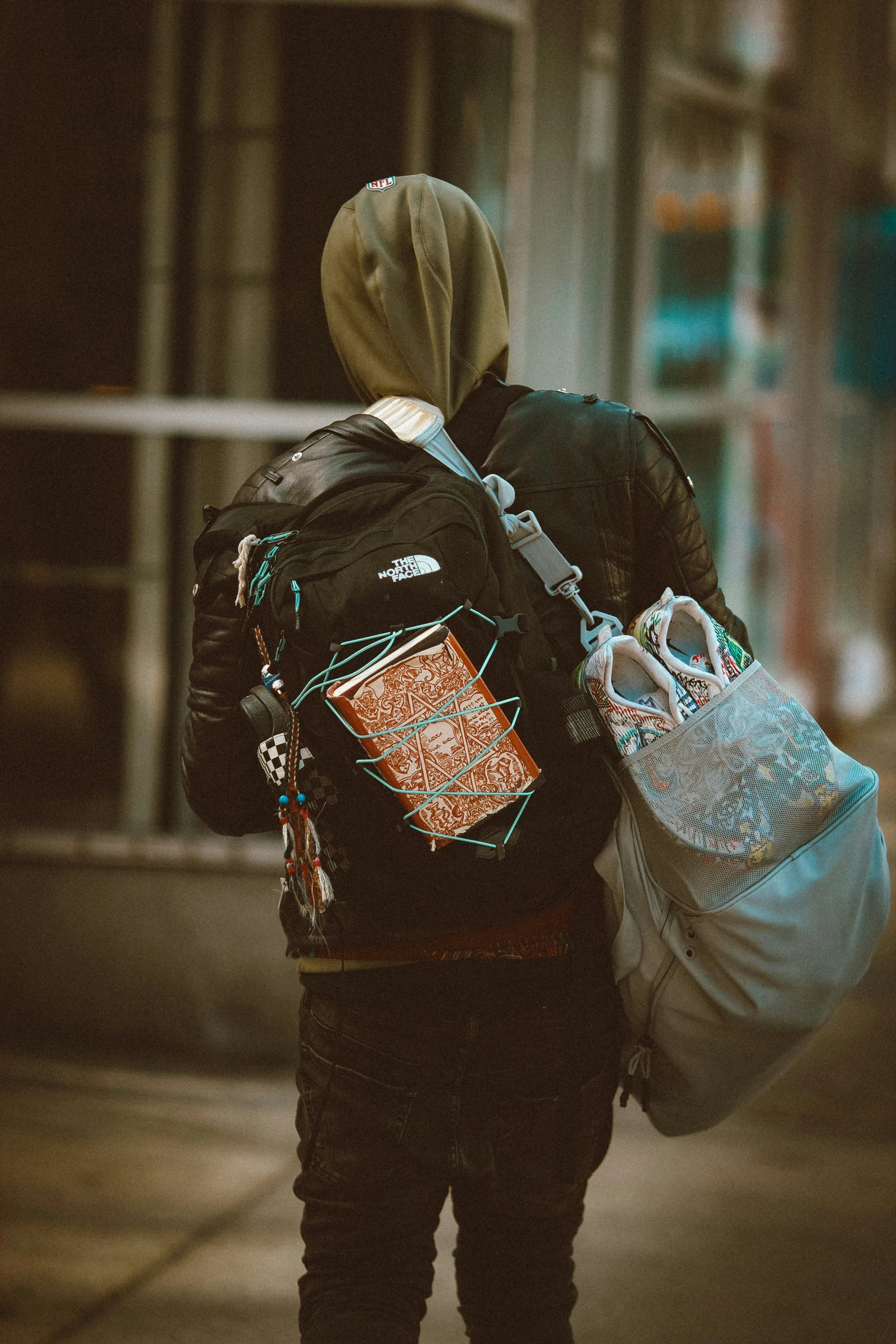 a man with backpack walking down the street