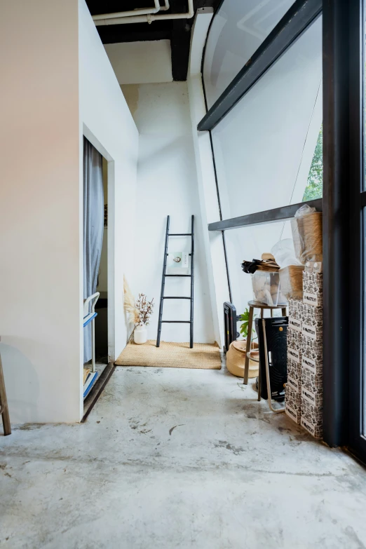 a room that has a ladder and a ladder in the wall