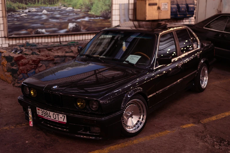 an image of an elegant black car parked in the street