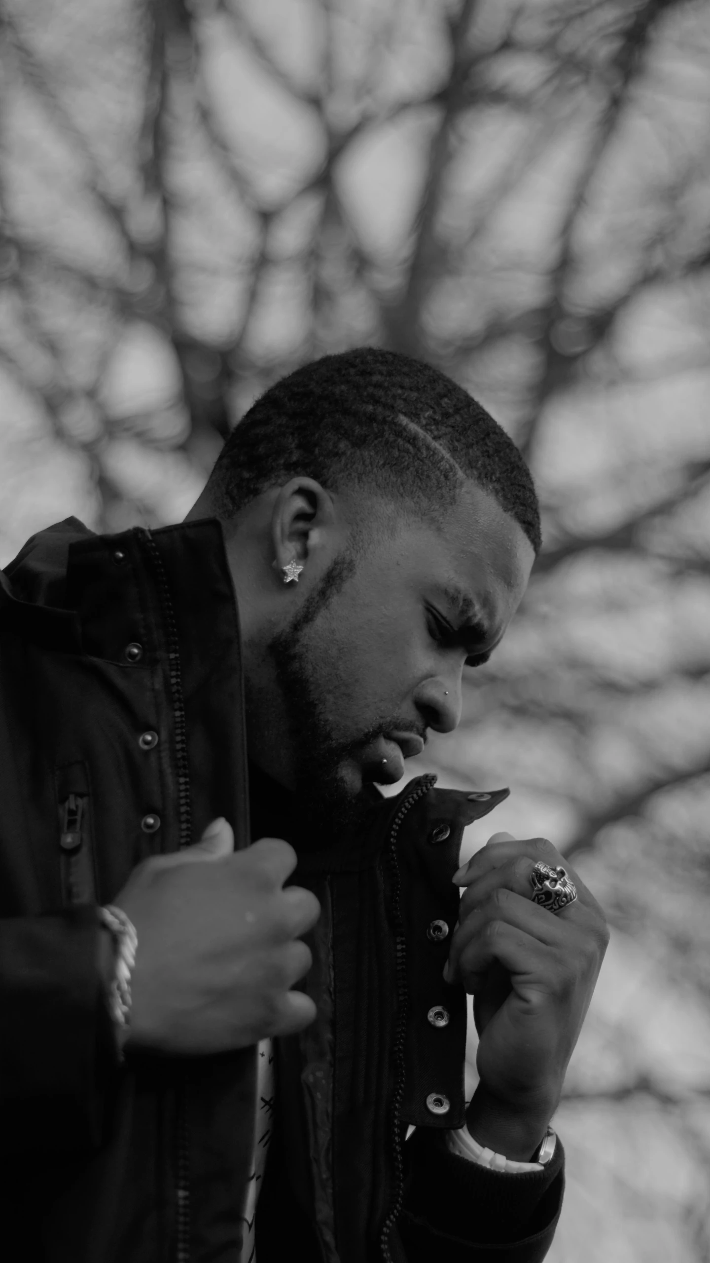 a man eating soing from a black container