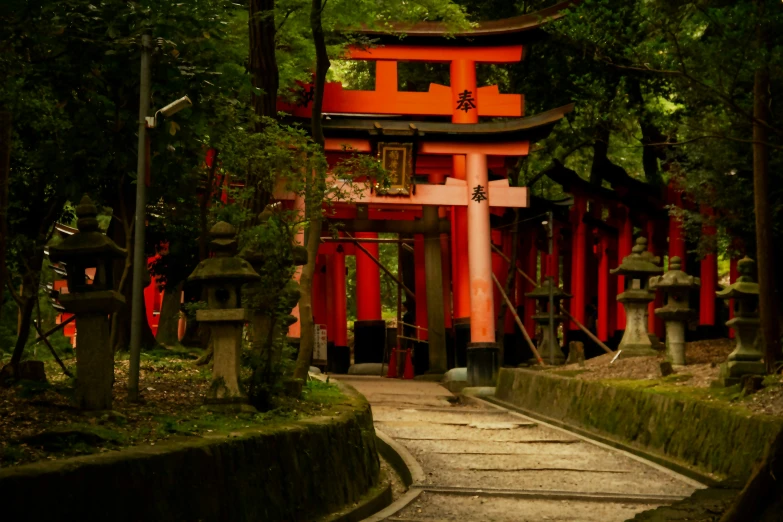 an oriental pagoda surrounded by trees and statues