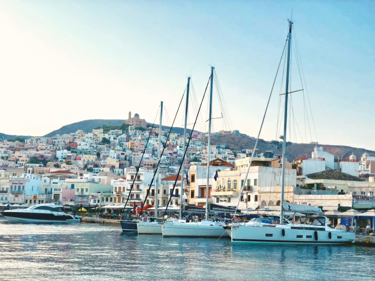 many sail boats are docked in the water