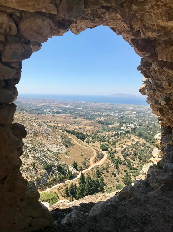 a picture of a view from inside a cave