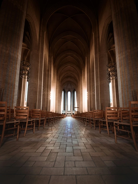 the light shines in from the windows on all sides of a large cathedral