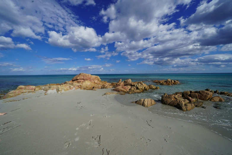 an ocean view shows low tide on a beach