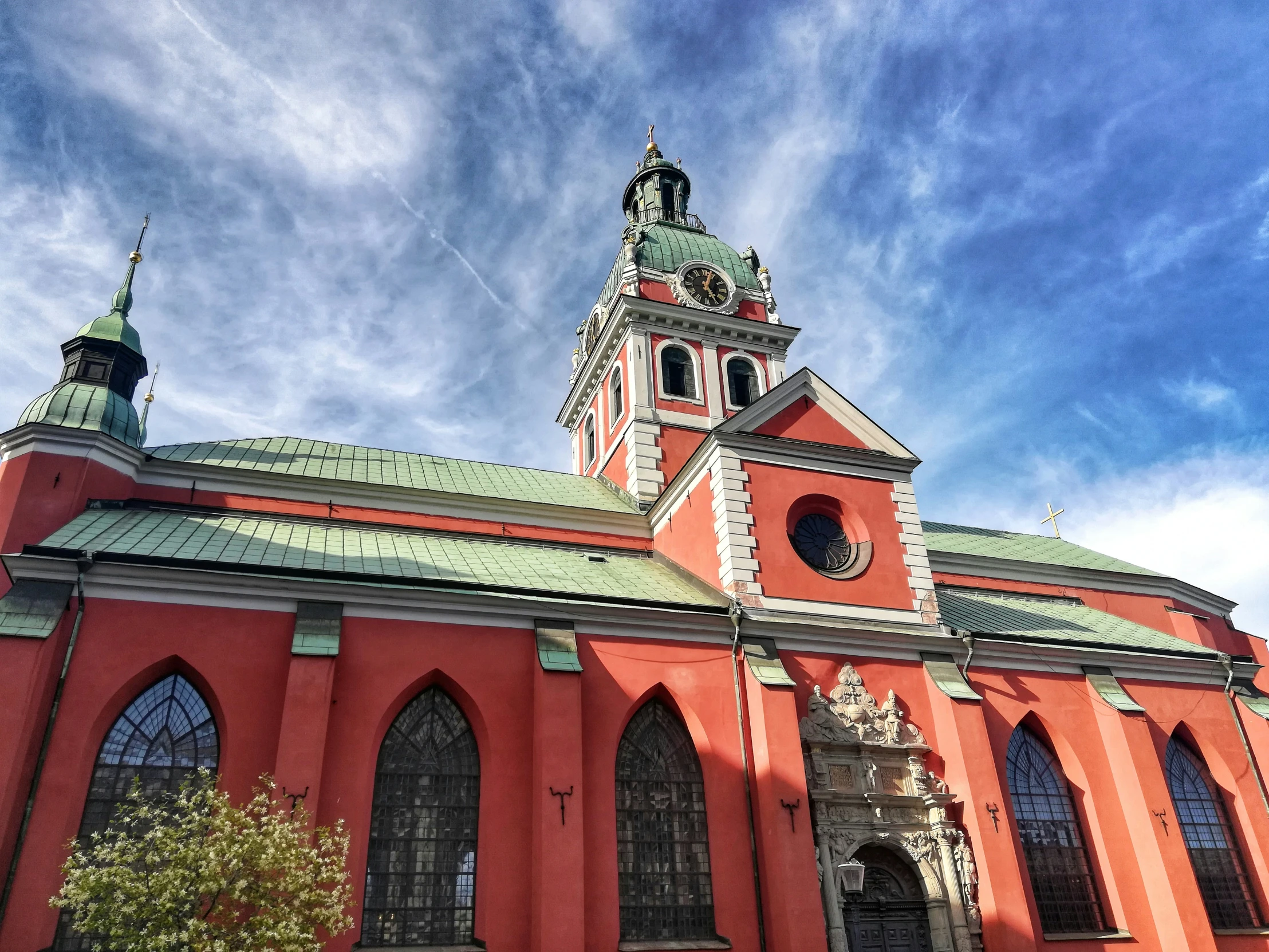 an orange church with some steeples on top