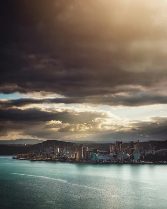 clouds are rolling over the city in front of the ocean