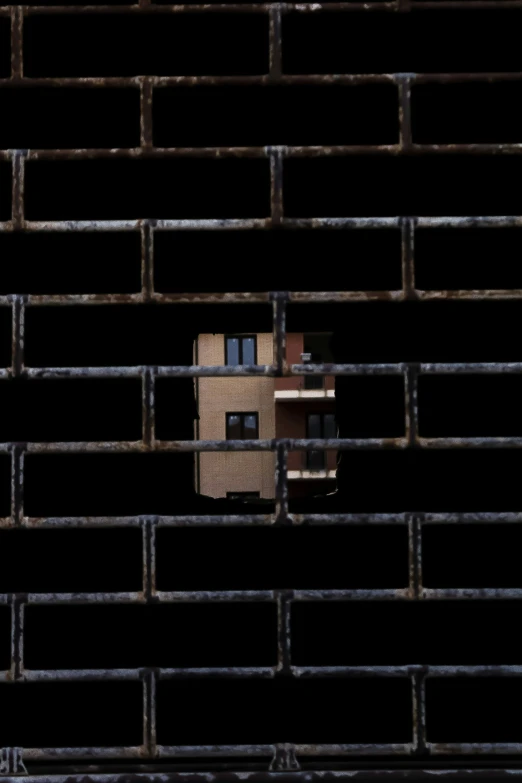 a brick wall with a building on it's side