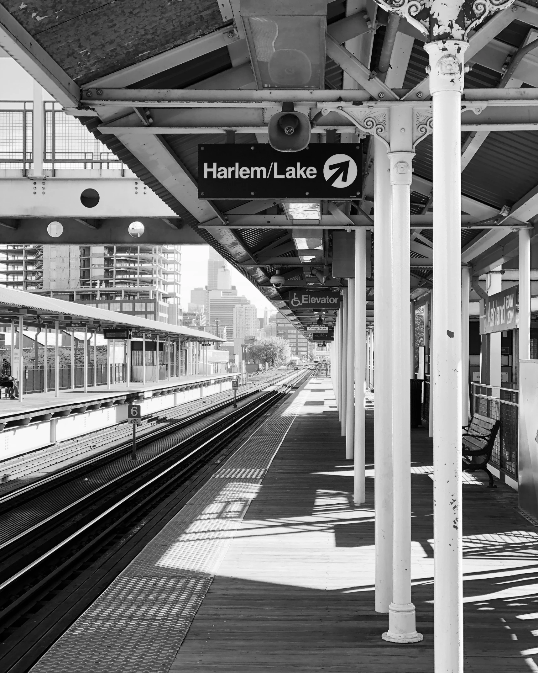 the platform in an outdoor train station is empty