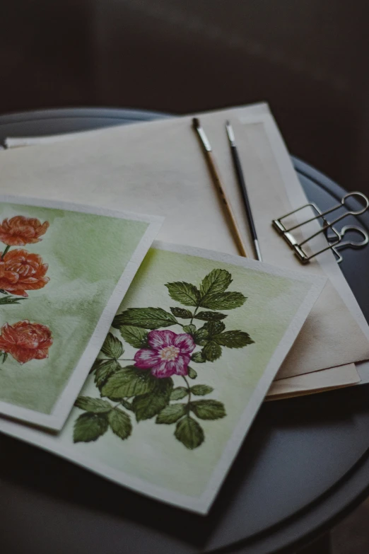 a set of three napkins with floral designs on them