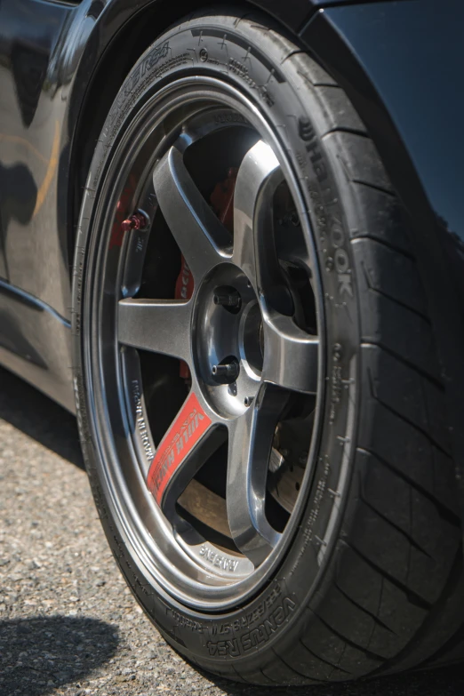 a very shiny tire and some sort of rim on a car