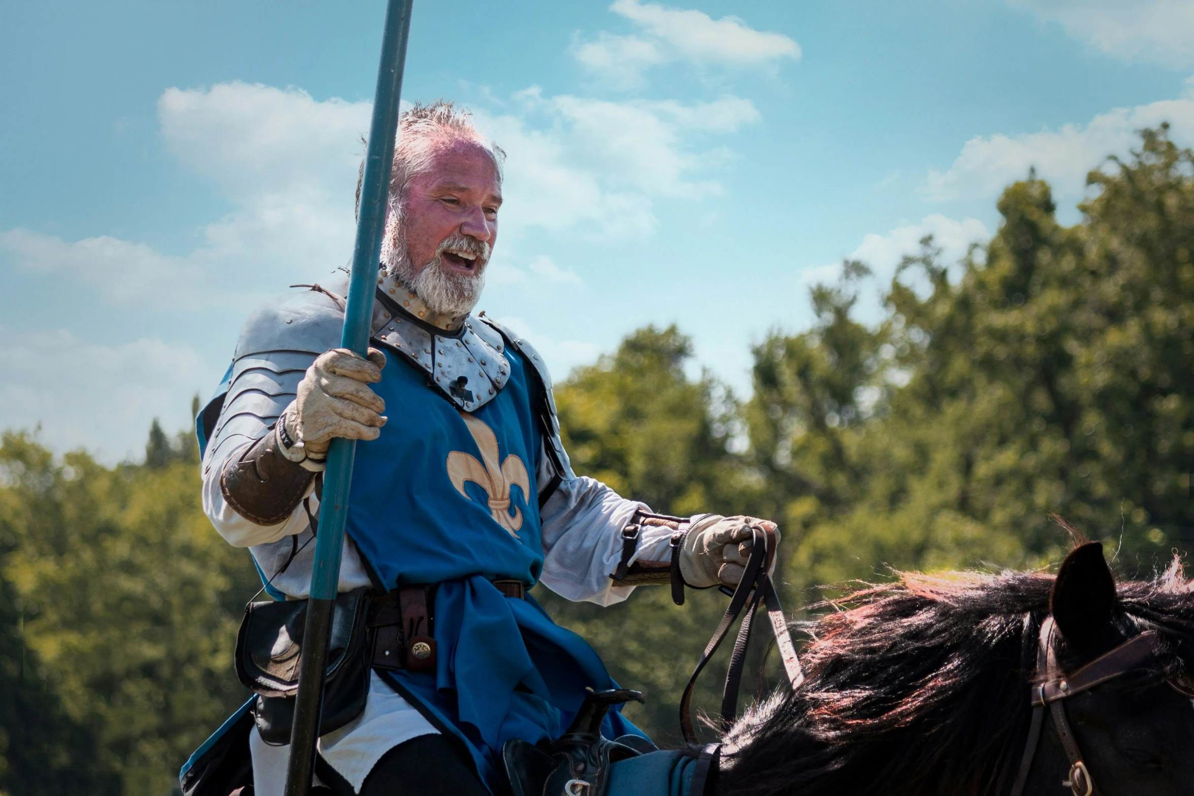 a man in an old age costume sitting on a horse