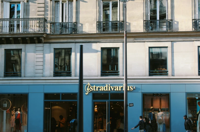 a building with some people walking past it