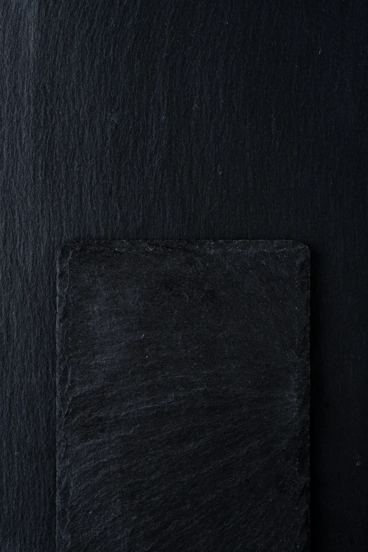 a dark picture of the corner of an empty piece of cloth