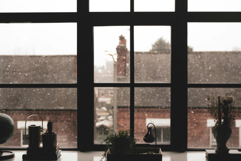 a window with some bottles and other items behind it