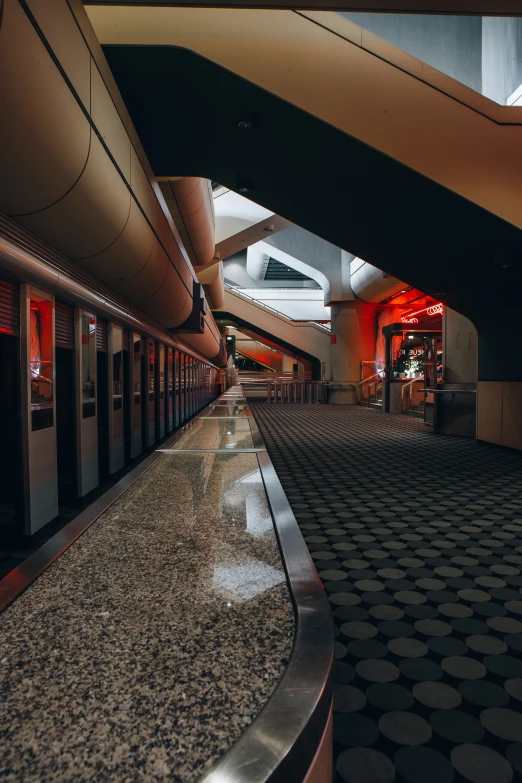 an empty train station has a long line of people