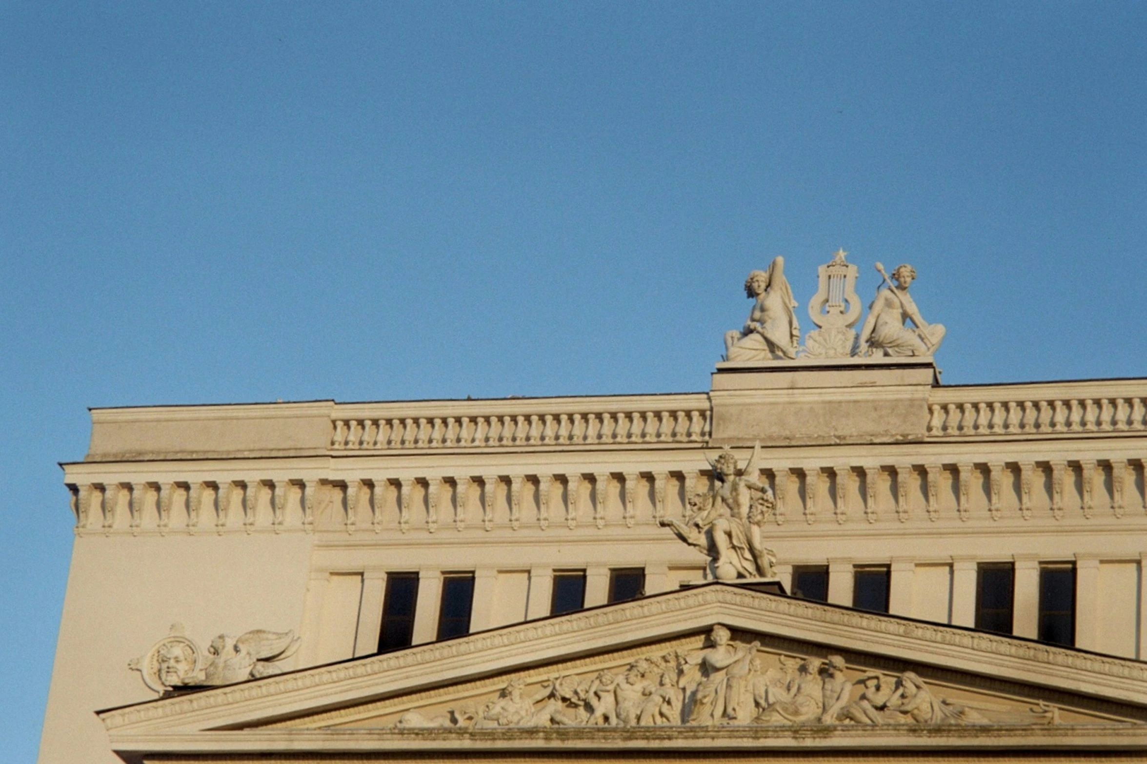 an artistic architectural structure with statues, including the head of a horse