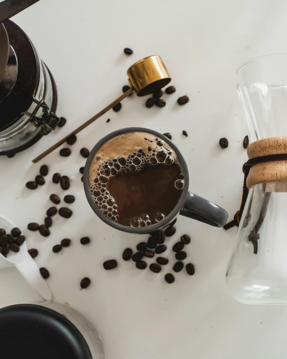 an overhead view of espresso with coffee beans