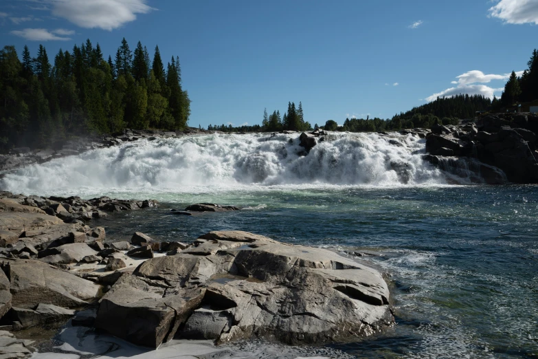 the water is coming down a small waterfall